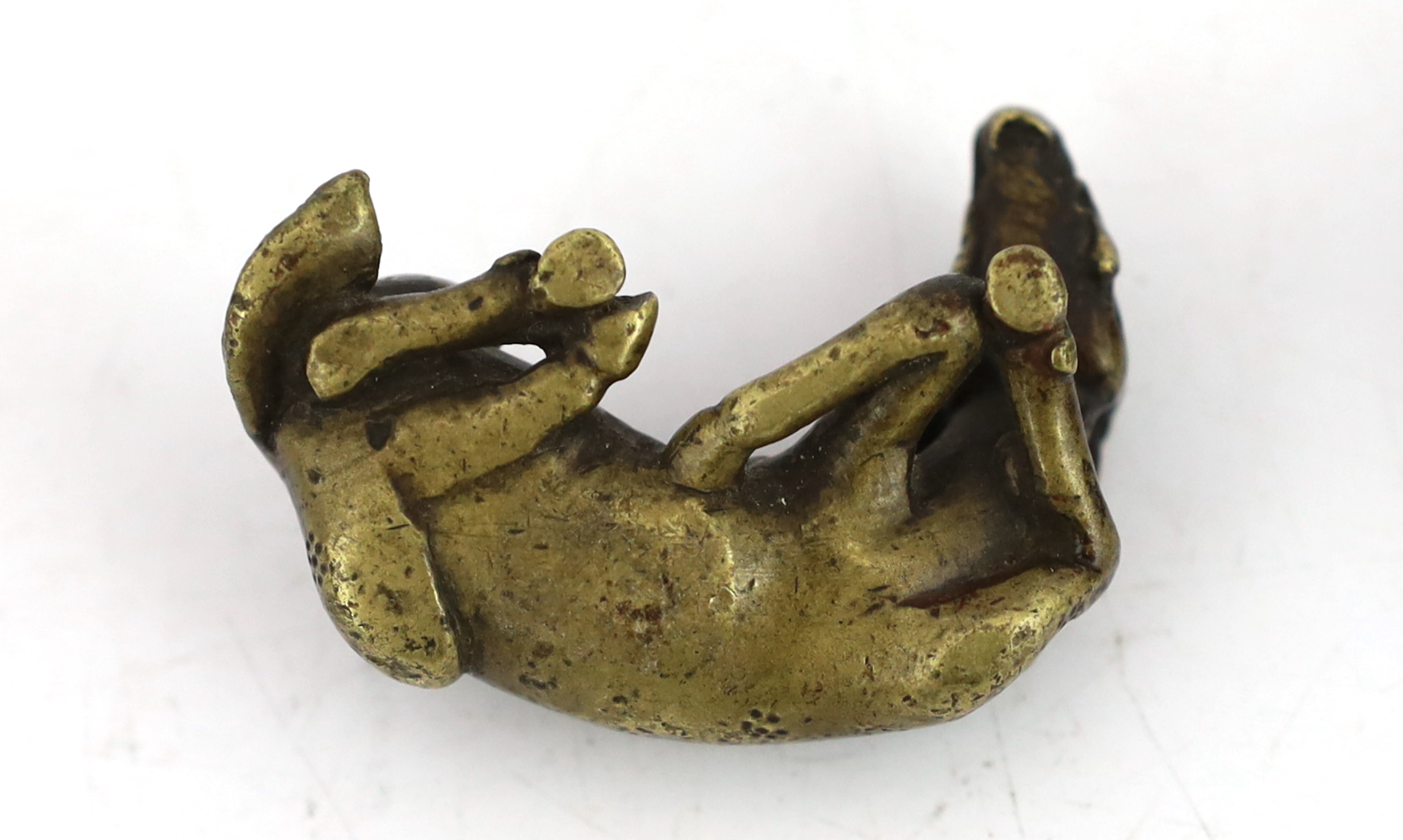 A Chinese bronze weight, in the form of a recumbent deer, late Ming/early Qing dynasty